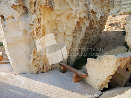 Image of Wooden bench in the rocks.