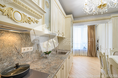 Image of Luxury modern neoclassic beige kitchen interior