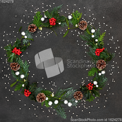 Image of Abstract Christmas Wreath with Baubles and Winter Flora