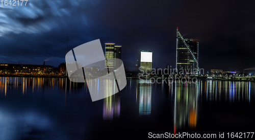 Image of Riga skyline with skyscrapers and water reflections