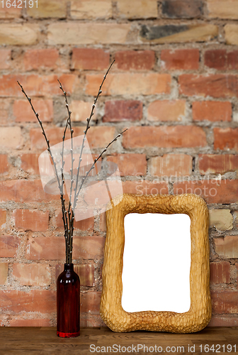 Image of Photo frame and clay bottle with willow catkins
