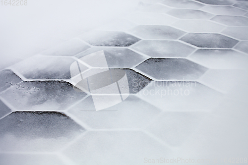 Image of Hexagonal tiles covered with snow