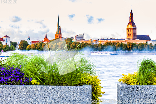 Image of Urban flower pots with Riga old town skyline