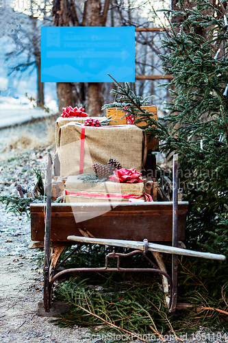 Image of Wooden sledge from the front with presents