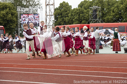 Image of Dancers in traditional costumes perform at the Grand Folk dance 