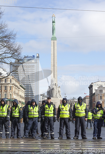 Image of Police line infront Freedom Monument in Riga, Latvia