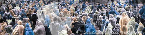 Image of Crowd in colorful raincoats