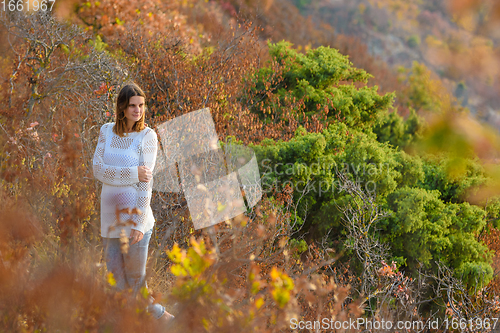 Image of Slender beautiful girl on the background of a beautiful forest landscape