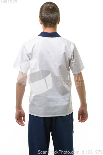 Image of A man in a medical shirt and pants, a view from the back