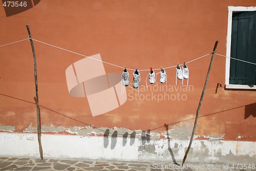 Image of Clothesline with shoes.