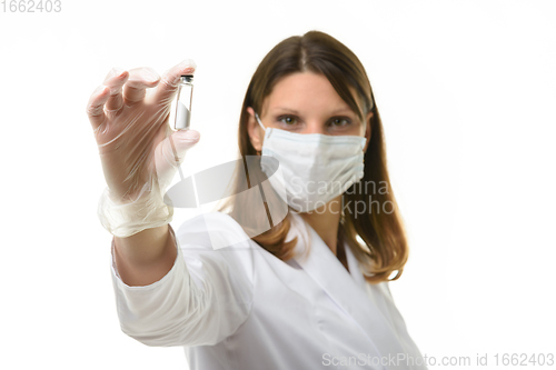 Image of Doctor shows a test tube with a drug in the frame