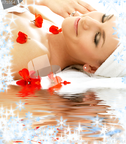 Image of red petals spa with water