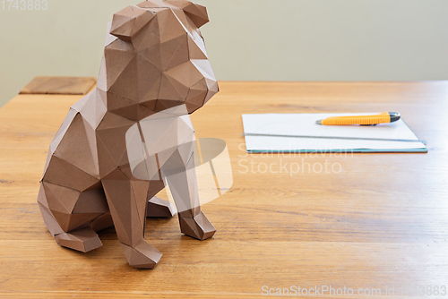 Image of Dog in polygon cubist style on the table.