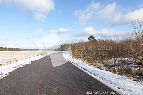 Image of asphalt road in the winter