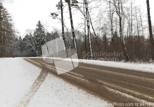 Image of road in the forest in winter