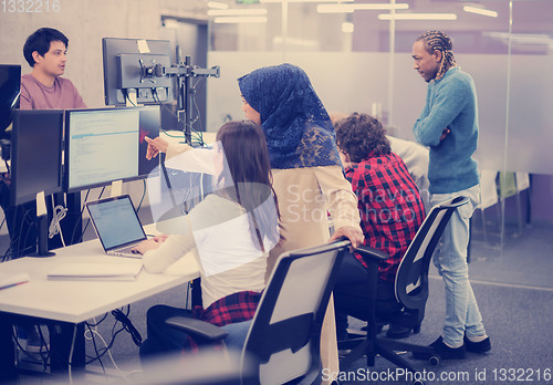 Image of multiethnics team of software developers working together