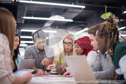 Image of Multiethnic startup business team having meeting