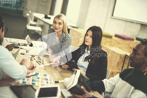 Image of multiethnic business team learning about drone technology