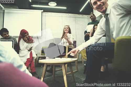 Image of Multiethnic startup business team having meeting