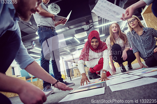 Image of black muslim woman having meeting with Multiethnic  startup busi