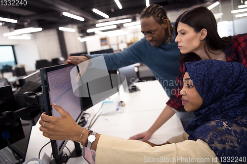 Image of multiethnics team of software developers working together