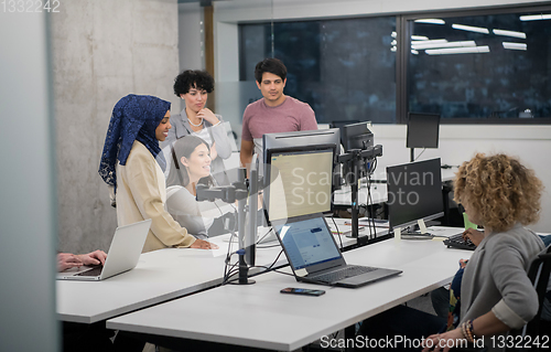 Image of multiethnics team of software developers working together