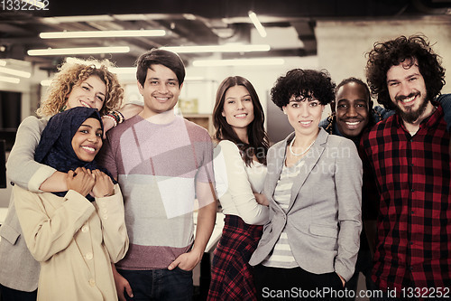 Image of portrait of young excited multiethnics business team
