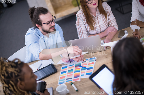 Image of multiethnic business team learning about drone technology