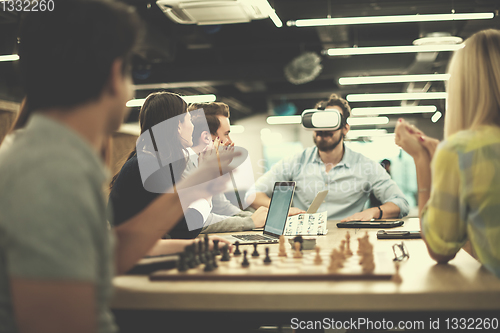 Image of Young Multiethnic Business team using virtual reality headset