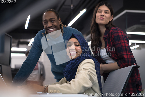 Image of multiethnics team of software developers working together