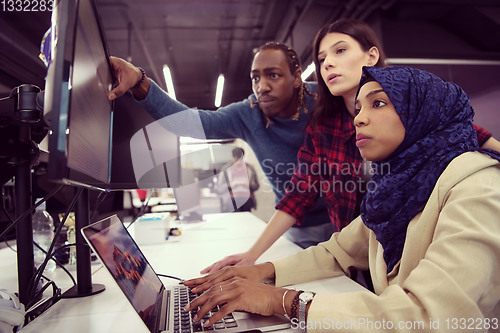 Image of multiethnics team of software developers working together