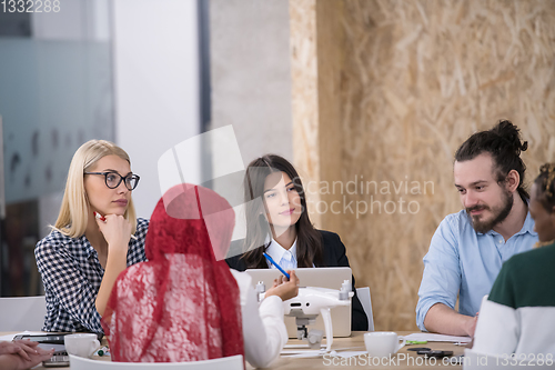 Image of multiethnic business team learning about drone technology