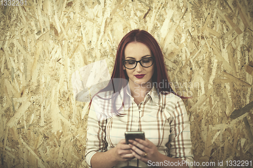 Image of portrait of young redhead business woman