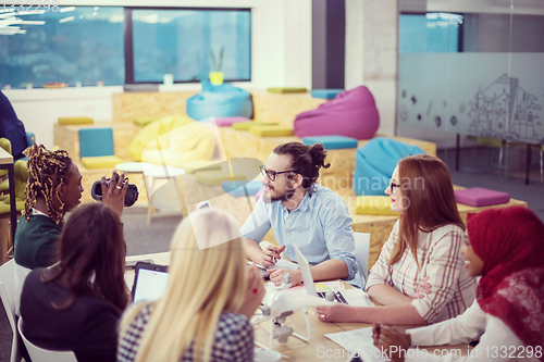 Image of Young Multiethnic Business team using virtual reality headset