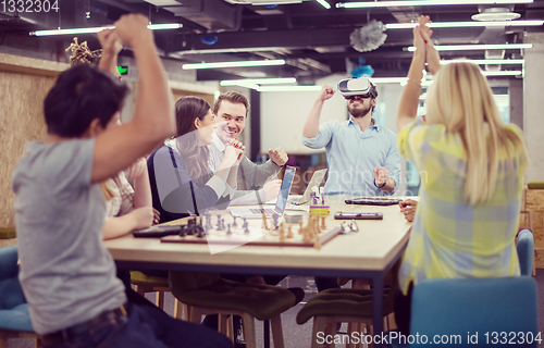 Image of Young Multiethnic Business team using virtual reality headset