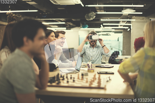 Image of Young Multiethnic Business team using virtual reality headset