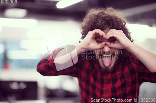 Image of Portrait of smiling male software developer