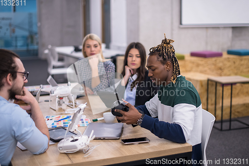 Image of Young Multiethnic Business team using virtual reality headset