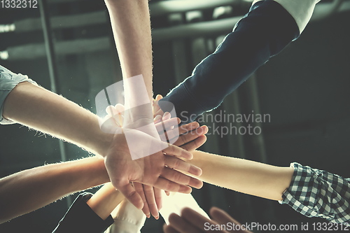 Image of multiethnic Group of young business people celebrating success