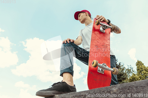 Image of Skateboarder at the city\'s street in sunny day