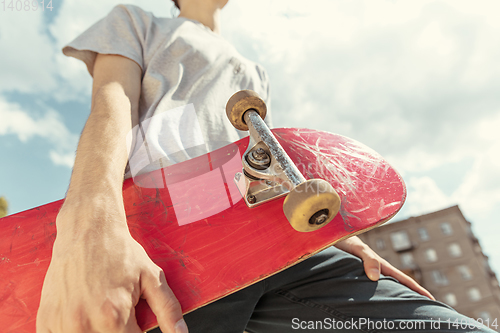 Image of Skateboarder at the city\'s street in sunny day