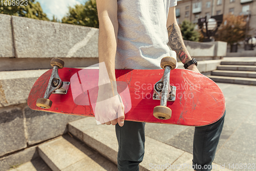 Image of Skateboarder at the city\'s street in sunny day