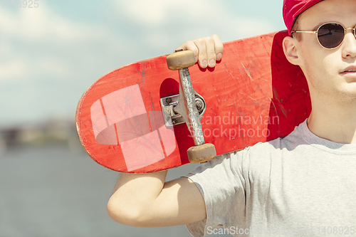 Image of Skateboarder at the city\'s street in sunny day