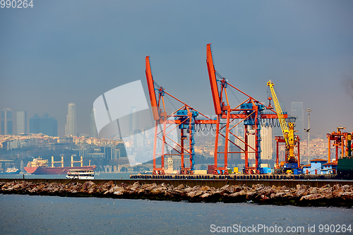 Image of Logistics and transportation of Container Cargo ship and Cargo plane with working crane bridge in shipyard, logistic import export and transport industry background