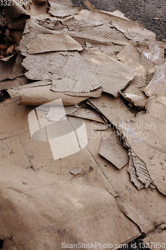 Image of Dumped, dirty and ripped corrugated cardboard