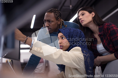 Image of multiethnics team of software developers working together