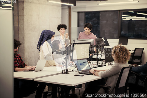 Image of multiethnics team of software developers working together