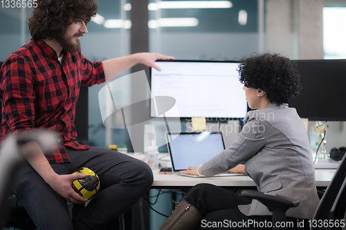 Image of software developers couple writing programming code