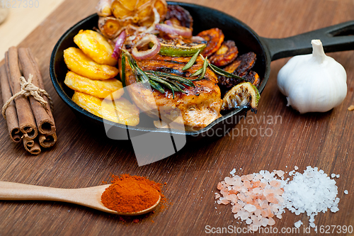 Image of roasted grilled BBQ chicken breast with herbs and spices 