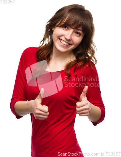 Image of Woman is showing thumb up gesture